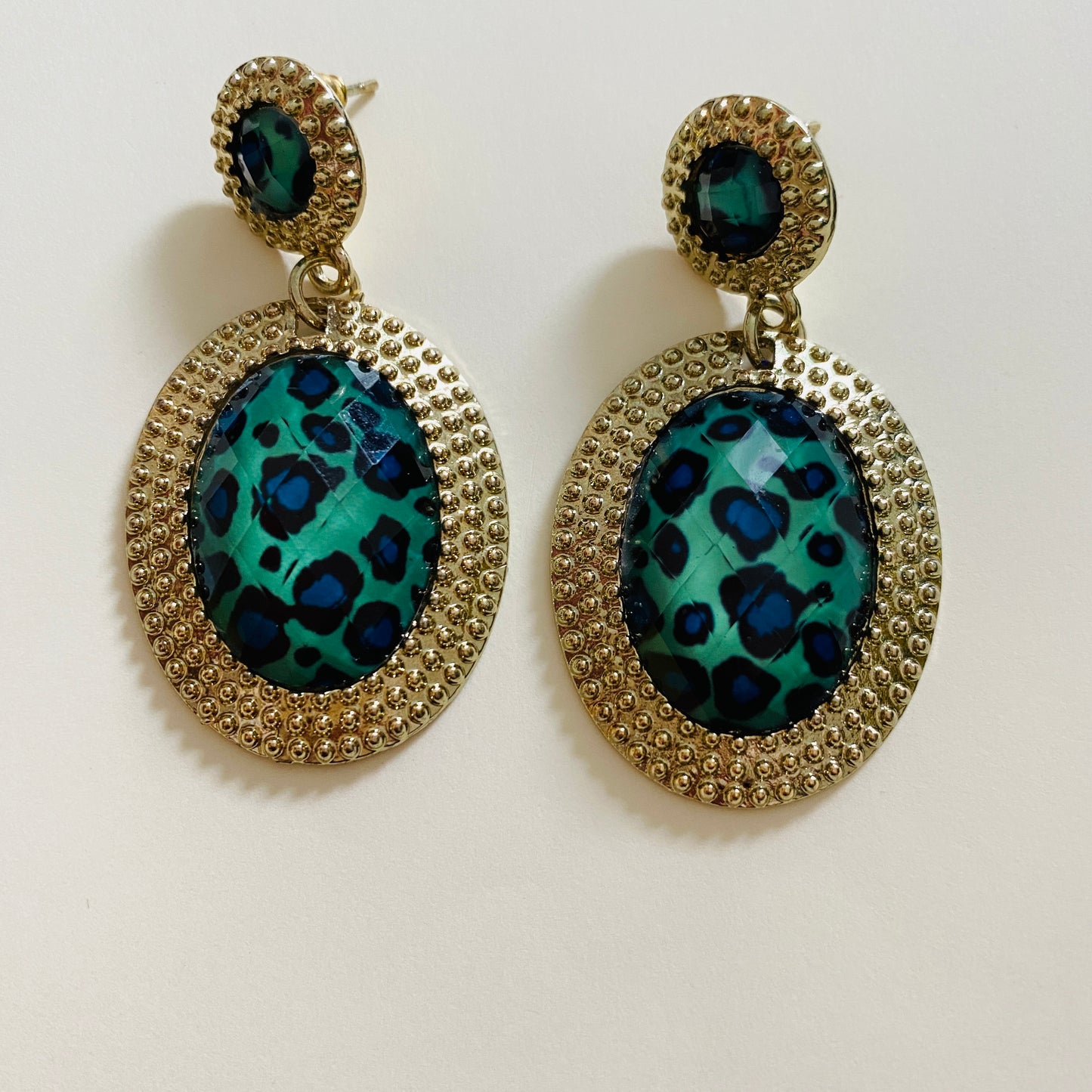 green and blue animal print earrings